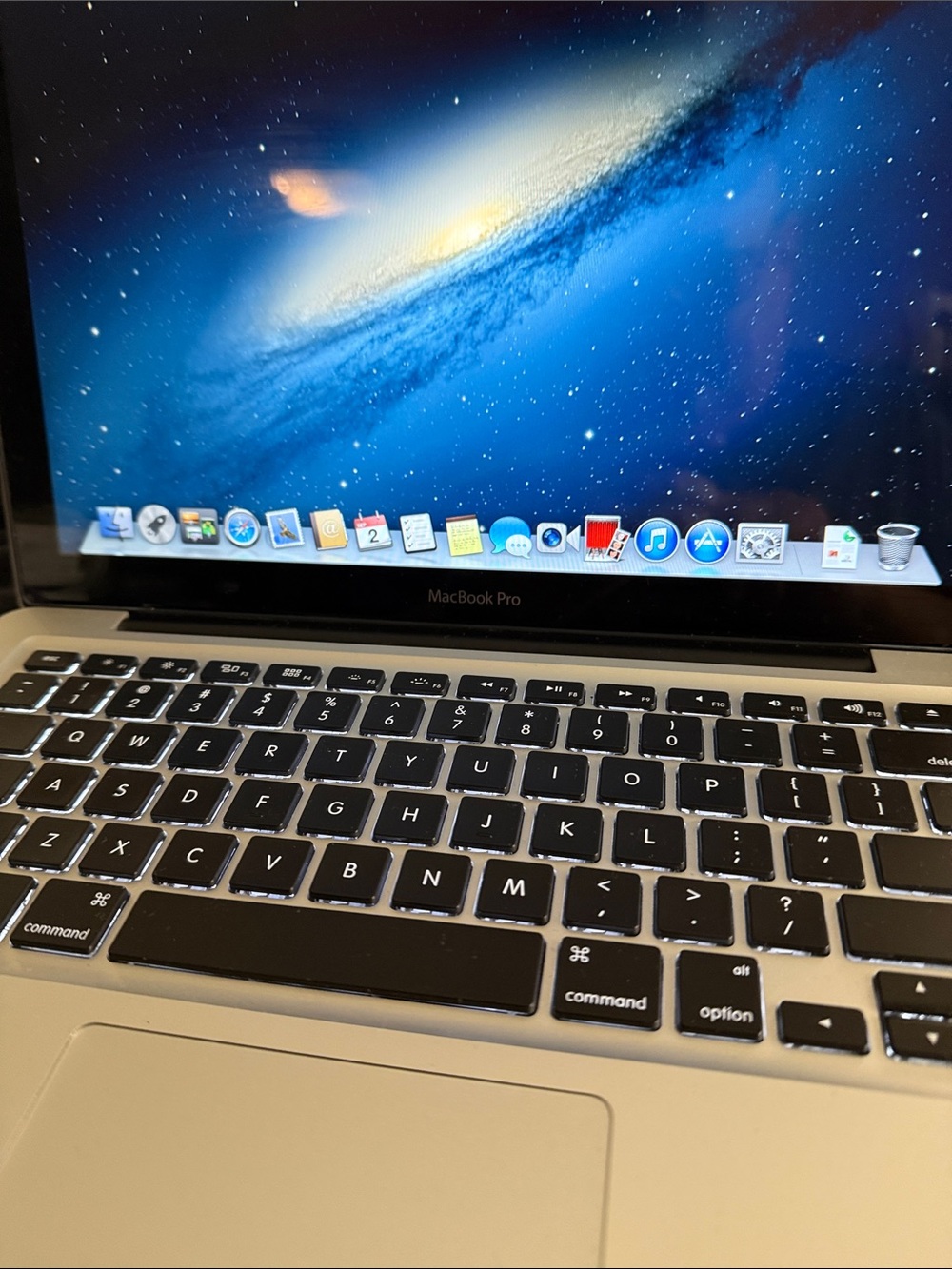 Apple MacBook Pro Silver with Black Keyboard and Blue Display